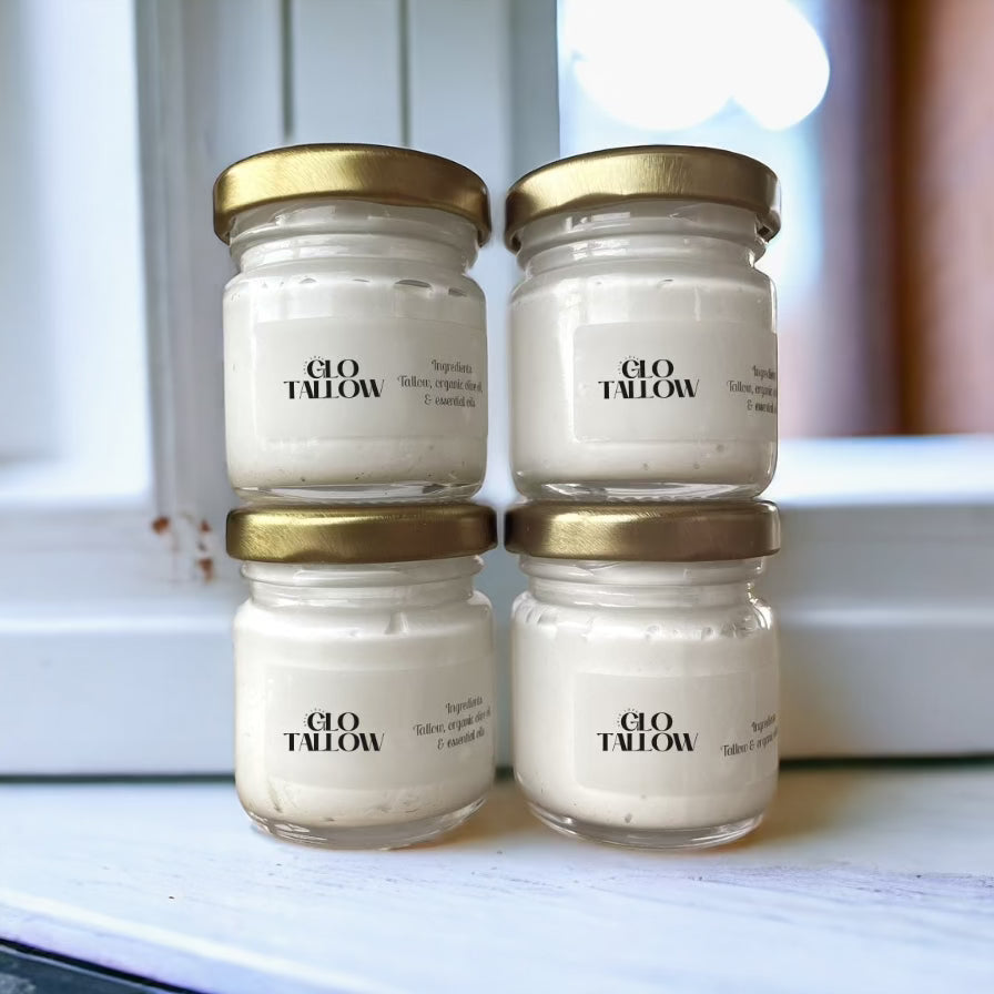 Glo Tallow Travel Size Tallow Balm, 4 jars stack on a window sill