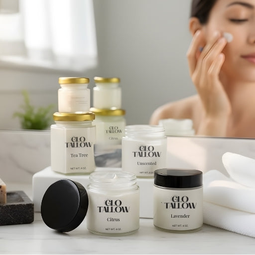 Glo Tallow skincare products on a bathroom counter with a person applying cream.